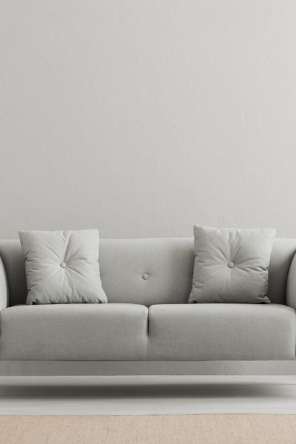 Poster,Above,White,Cabinet,With,Plant,Next,To,Grey,Sofa