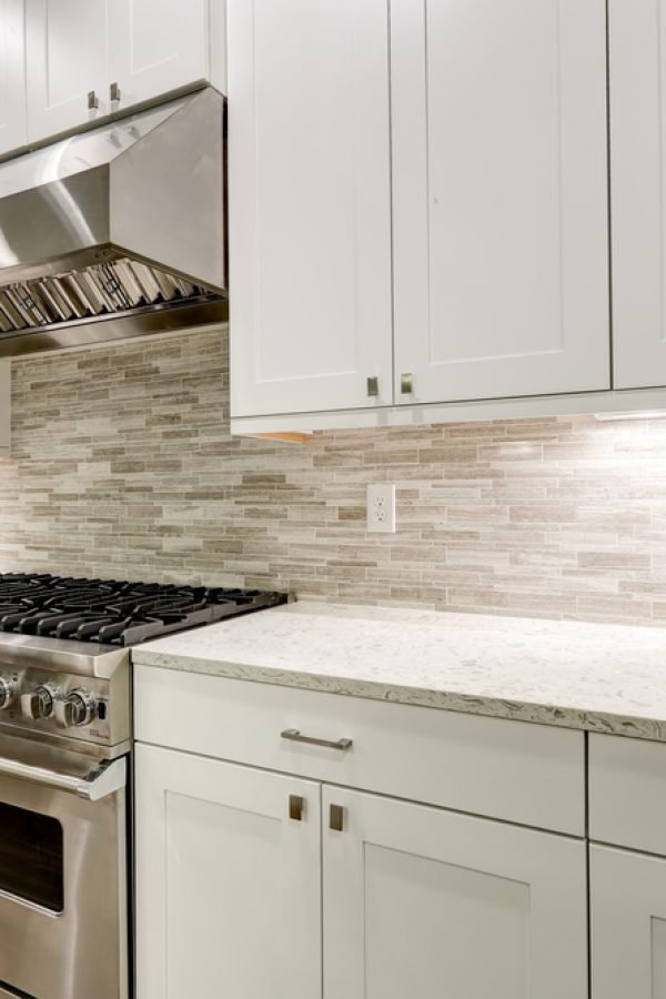 Gourmet,Kitchen,Features,White,Shaker,Cabinets,With,Marble,Countertops,Paired